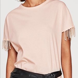 Powder pink shirt with pearls on the side